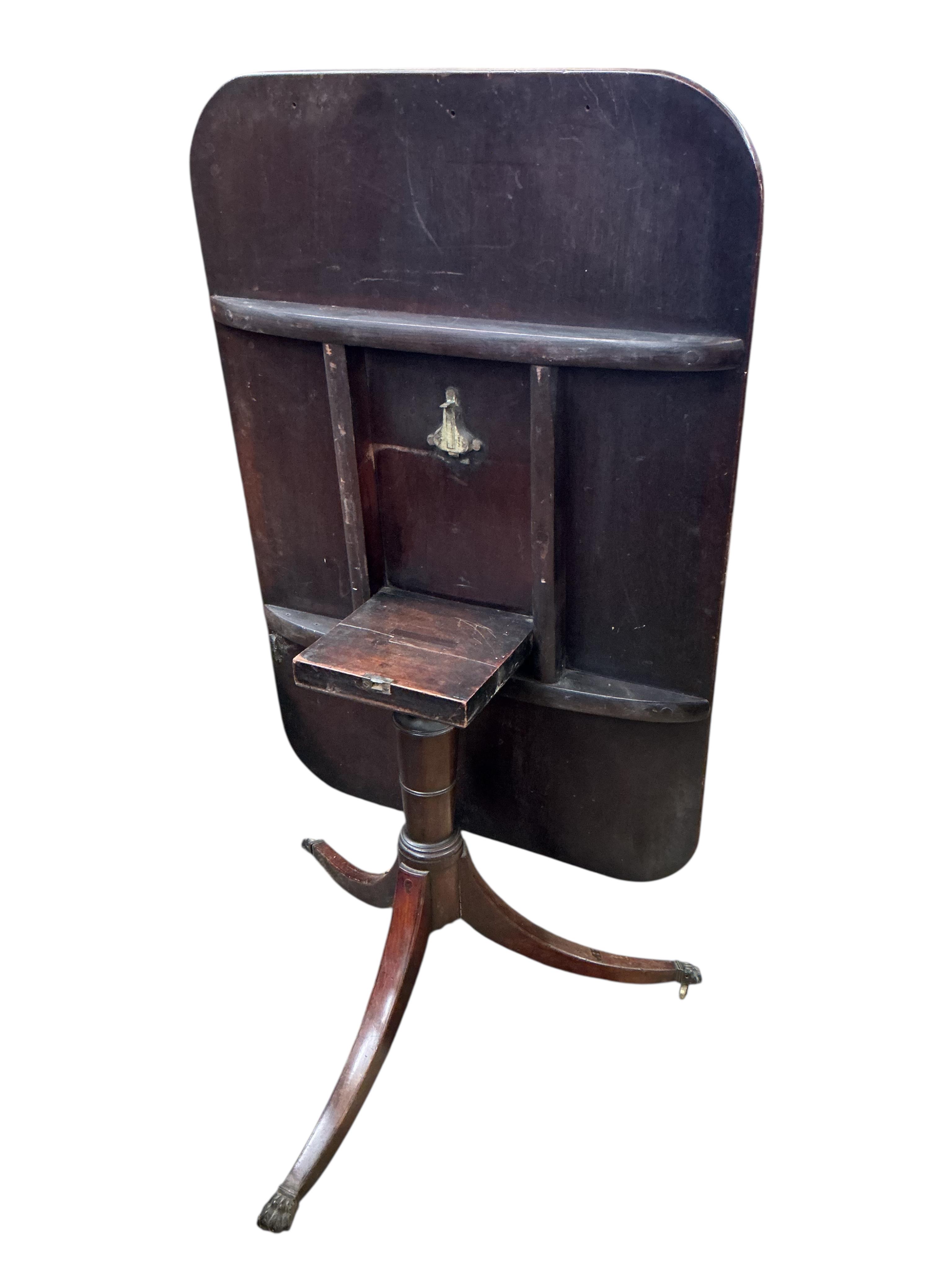 A Regency rectangular mahogany tilt top tripod dining table, width 114cm, depth 76cm, height 72cm
